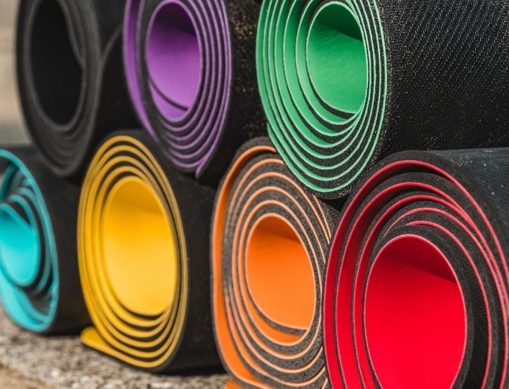 The complete range of YoYoga mats, rolled up